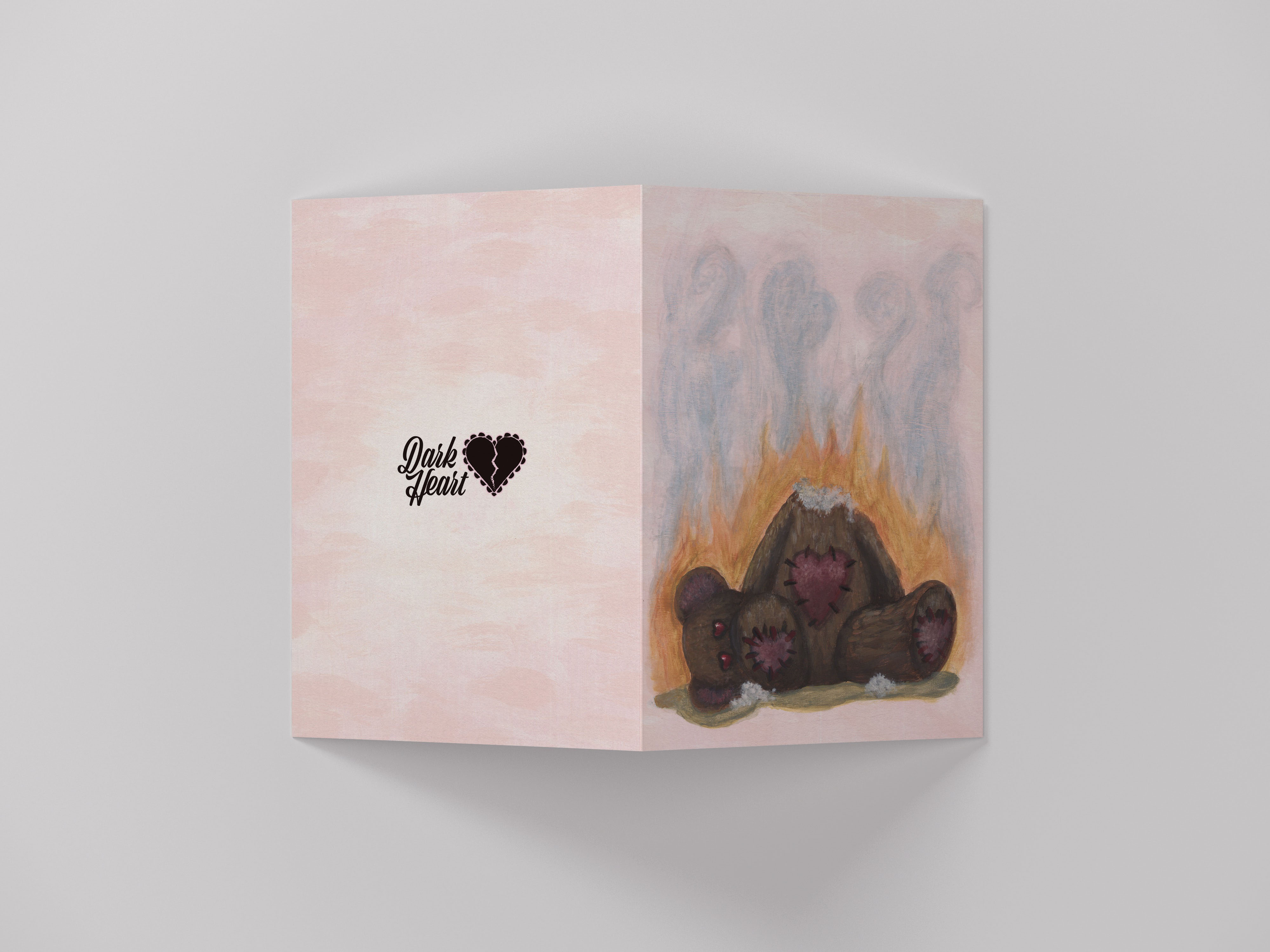 Greeting card with burning teddy bear